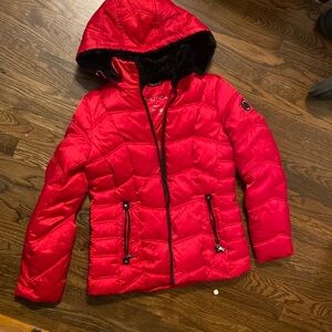 Red puffer jacket. For cold weather.